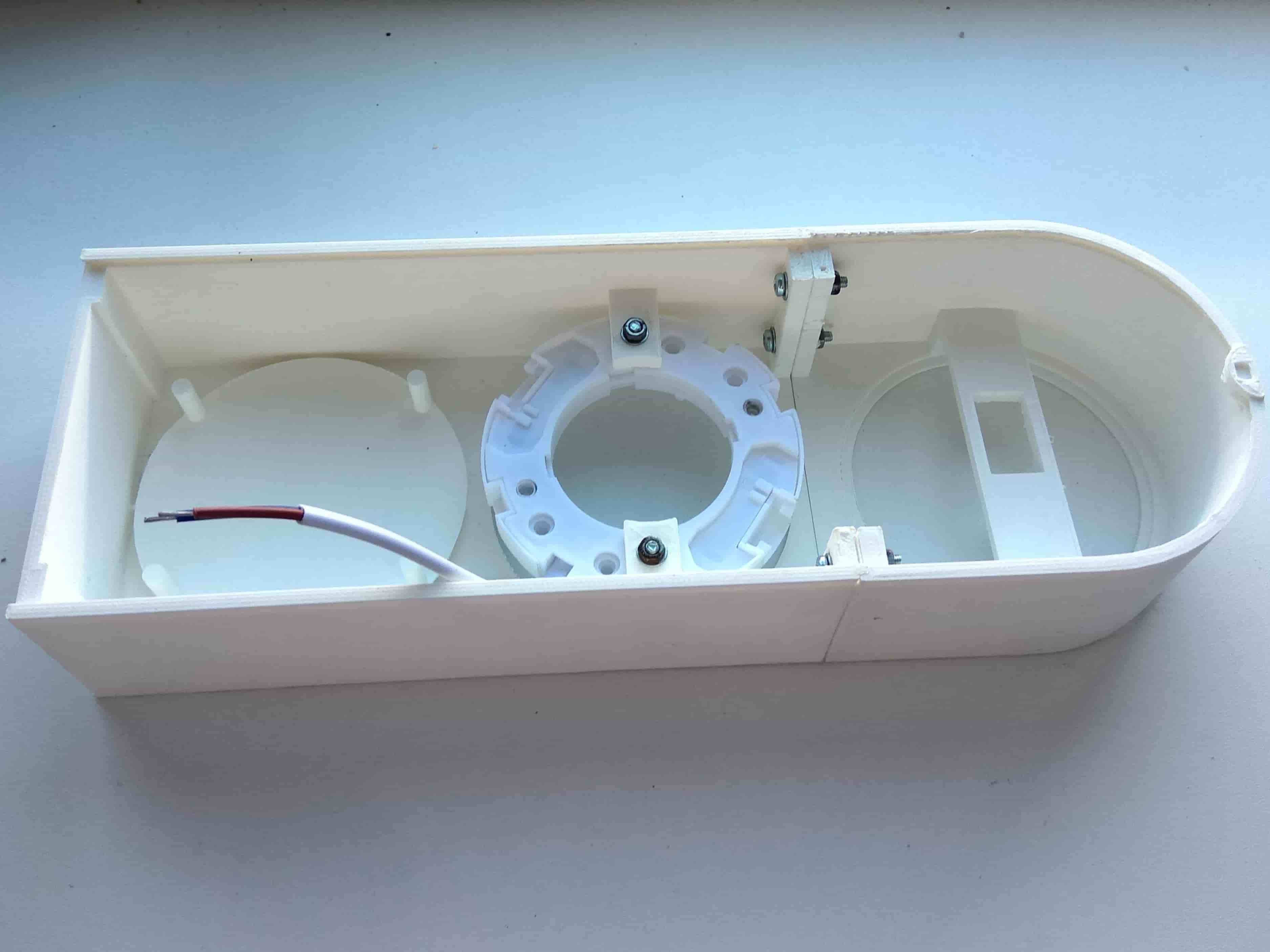 3D-printed enclosure with the camera mounting ring and internal brackets installed