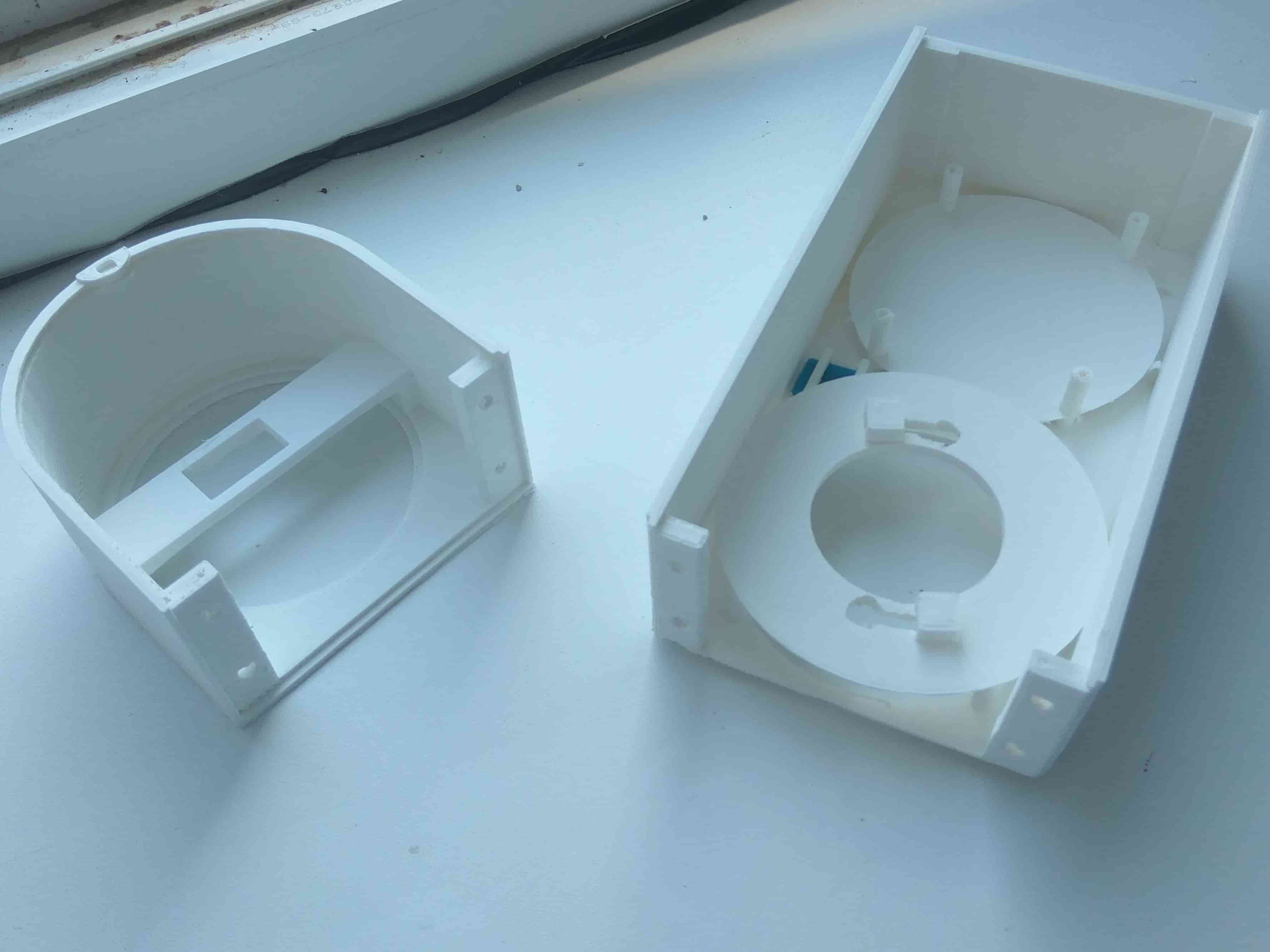 Early 3D-printed enclosure halves, prior to mounting internal components