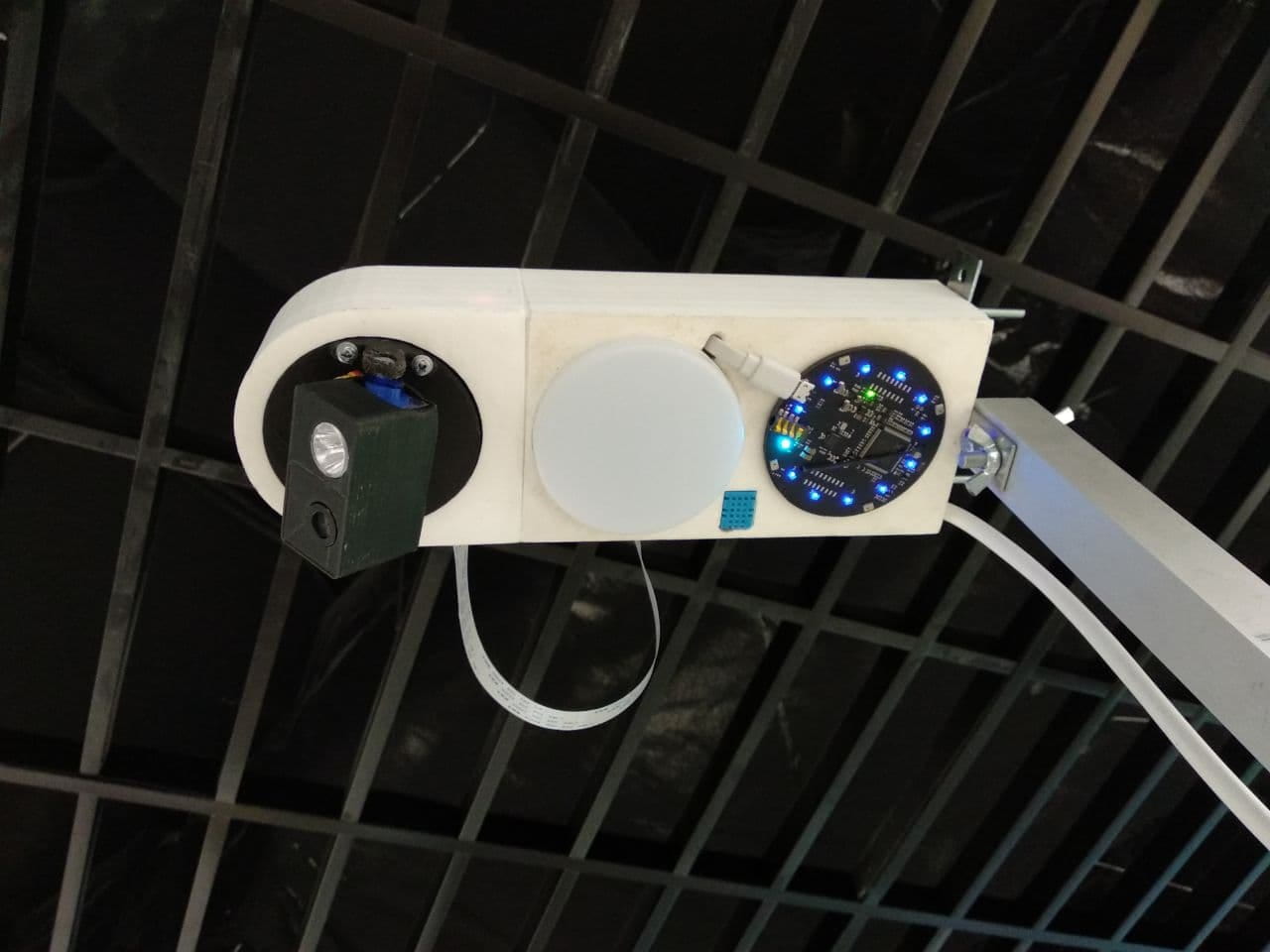 The completed Smart Light unit mounted overhead, with the LED floodlight, static light, and sensor board visible